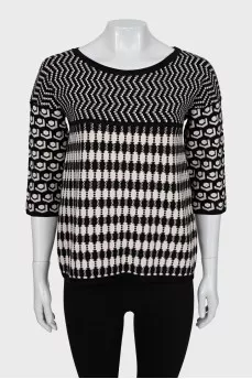 Knitted sweater in a combined print