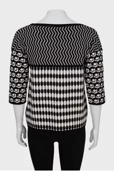 Knitted sweater in a combined print