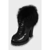 Leather ankle boots decorated with fur