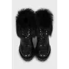Leather ankle boots decorated with fur