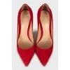 Red suede pumps