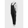 Leather jumpsuit with silver buttons