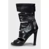 Leather ankle boots decorated with zippers