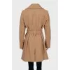 Single breasted coat with gold buttons