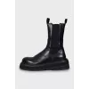 Black leather boots with chunky soles