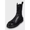 Black leather boots with chunky soles