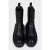 Black leather boots with chunky soles