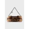 Shoulder bag decorated with fur