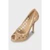Patent leather shoes with perforations