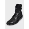 Black leather lace-up boots