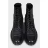 Black leather lace-up boots