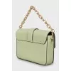 Green bag with gold logo