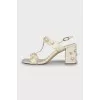 Snakeskin sandals with decor