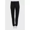 Wool trousers decorated with studs