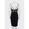 Dress with straps decorated with spikes