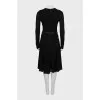 Fitted black dress with long sleeves