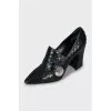 Snakeskin shoes with figured heels
