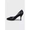 Black leather shoes with perforations