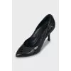 Black leather shoes with perforations
