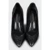 Black leather shoes with perforations