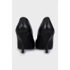 Black leather shoes with perforations