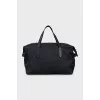 Travel bag in branded print