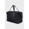 Travel bag in branded print