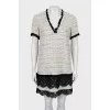 Dress decorated with lace and fringe