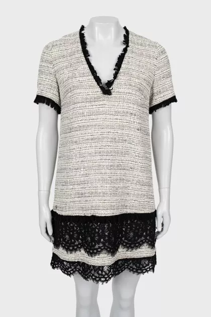 Dress decorated with lace and fringe