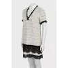 Dress decorated with lace and fringe