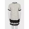 Dress decorated with lace and fringe