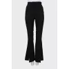 Flared trousers with slits at the bottom