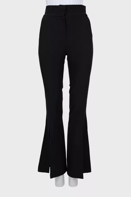 Flared trousers with slits at the bottom