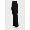 Flared trousers with slits at the bottom