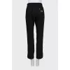 Striped trousers with zipper at the bottom
