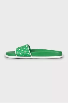 Green slippers decorated with spikes