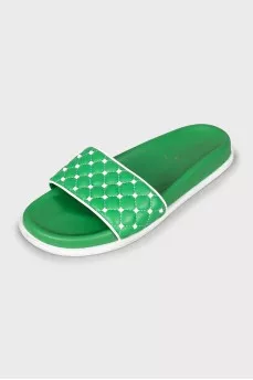 Green slippers decorated with spikes