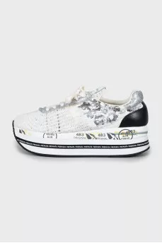 Textile sneakers decorated with sequins