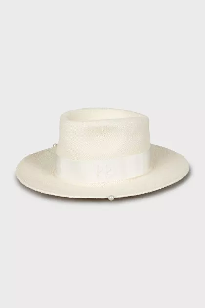 Straw hat decorated with beads