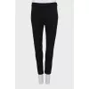 Tight-fitting trousers with zips at the bottom