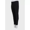 Tight-fitting trousers with zips at the bottom