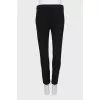 Tight-fitting trousers with zips at the bottom