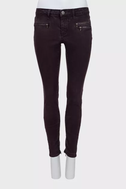 Purple jeans decorated with zippers