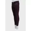 Purple jeans decorated with zippers