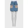 Denim mini skirt with gold hardware