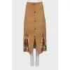 Brown skirt with embroidered pattern
