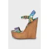 Textile sandals on a wooden wedge