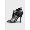 Suede ankle boots with silver print