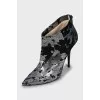Suede ankle boots with silver print