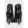 Suede ankle boots with silver print
